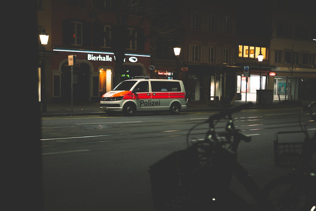 white and red car on road during night time