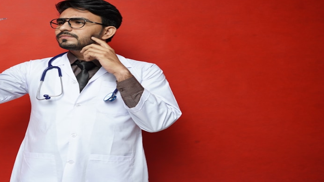 person in blue denim jeans lying on bed