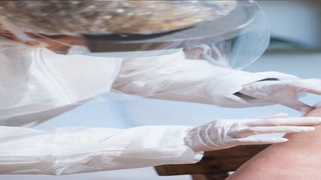 person in blue denim jeans lying on bed