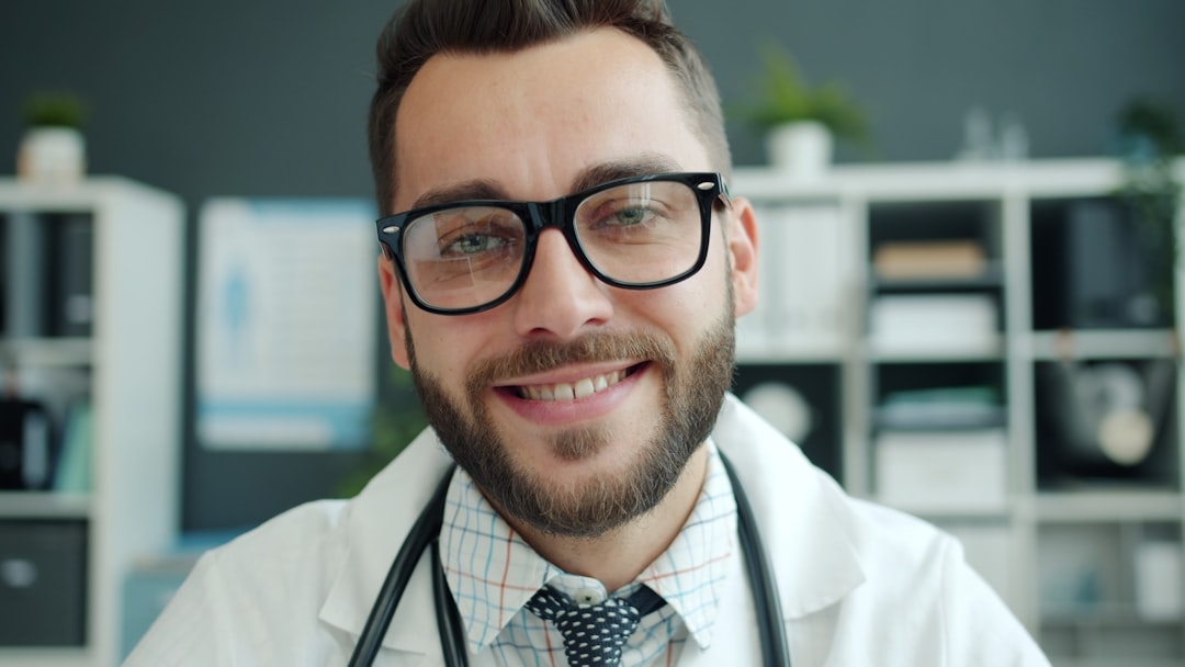 person in blue denim jeans lying on bed