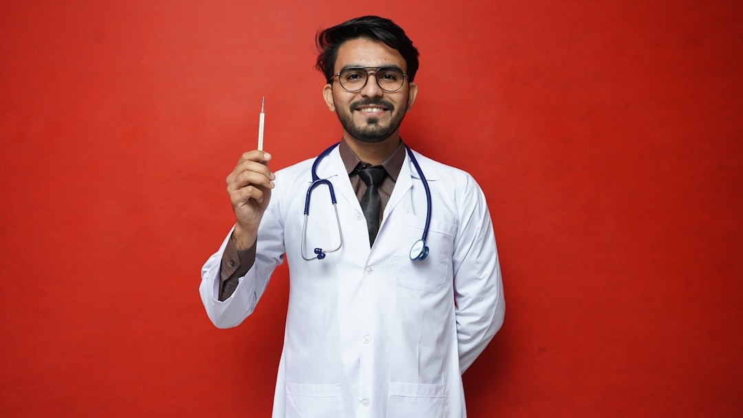 a person standing in a room looking out a window