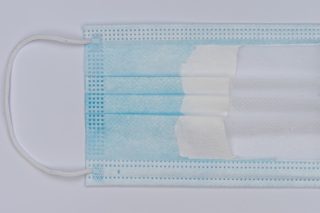 white and blue paper on white table