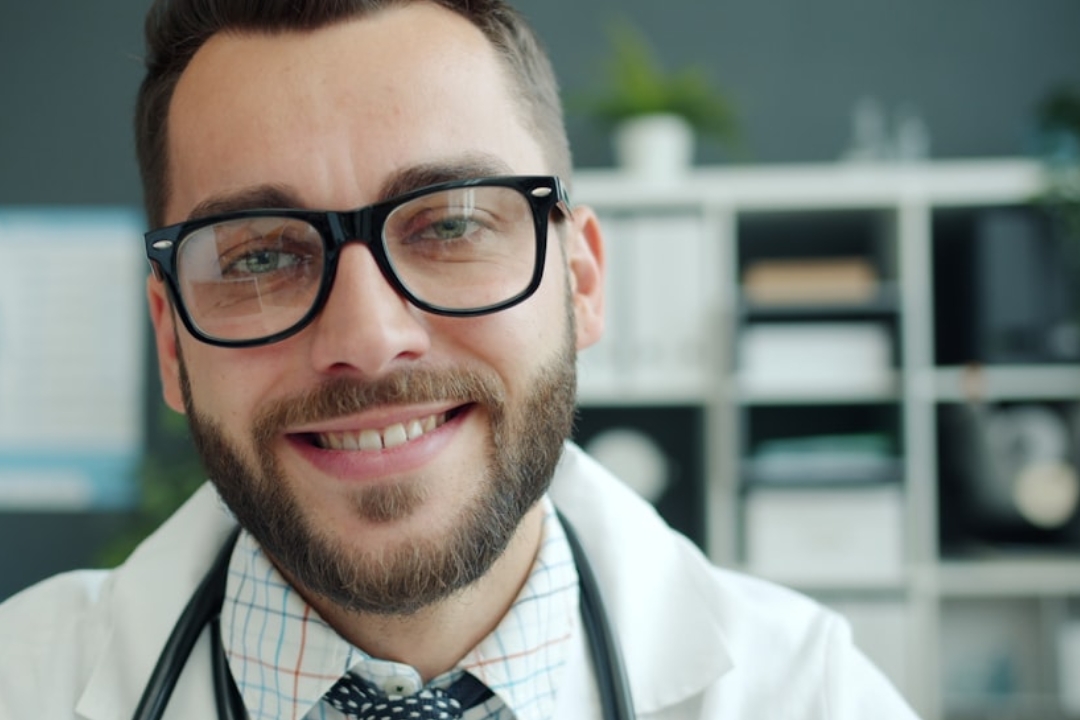 a laptop computer sitting on top of a wooden desk