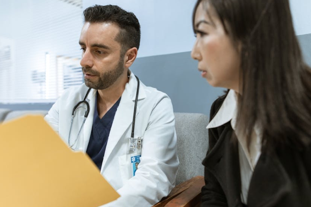 a person standing in front of a computer monitor