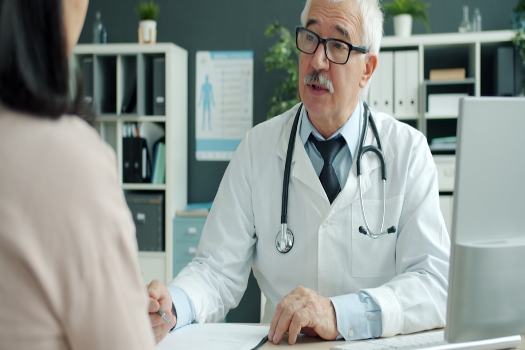 a desk with a computer on top of it