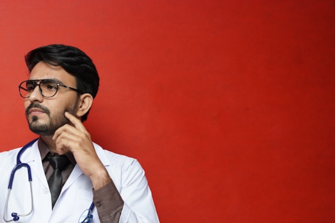 person in white shirt lying on bed