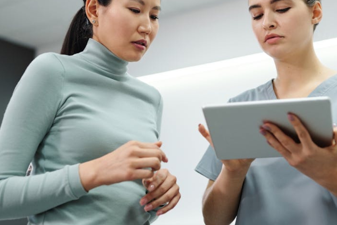 girl lying on white bed