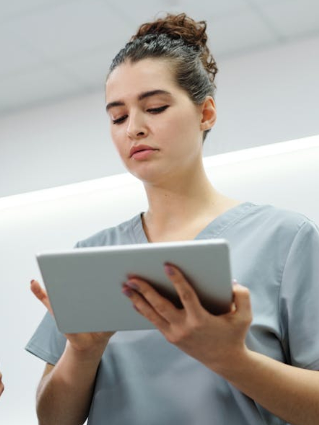 an orange cat laying on top of a metal table