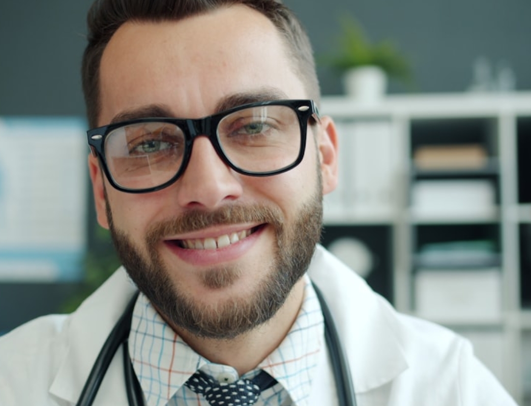 white bed comforter set and brown wooden bed frame beside brown wooden nightstand