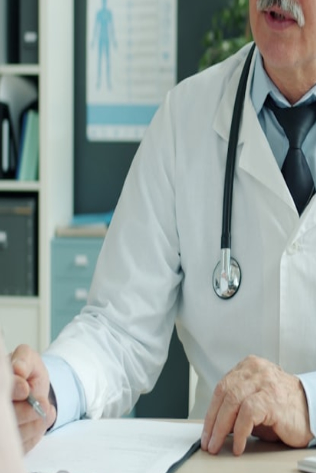 a woman sitting on a bed in a room