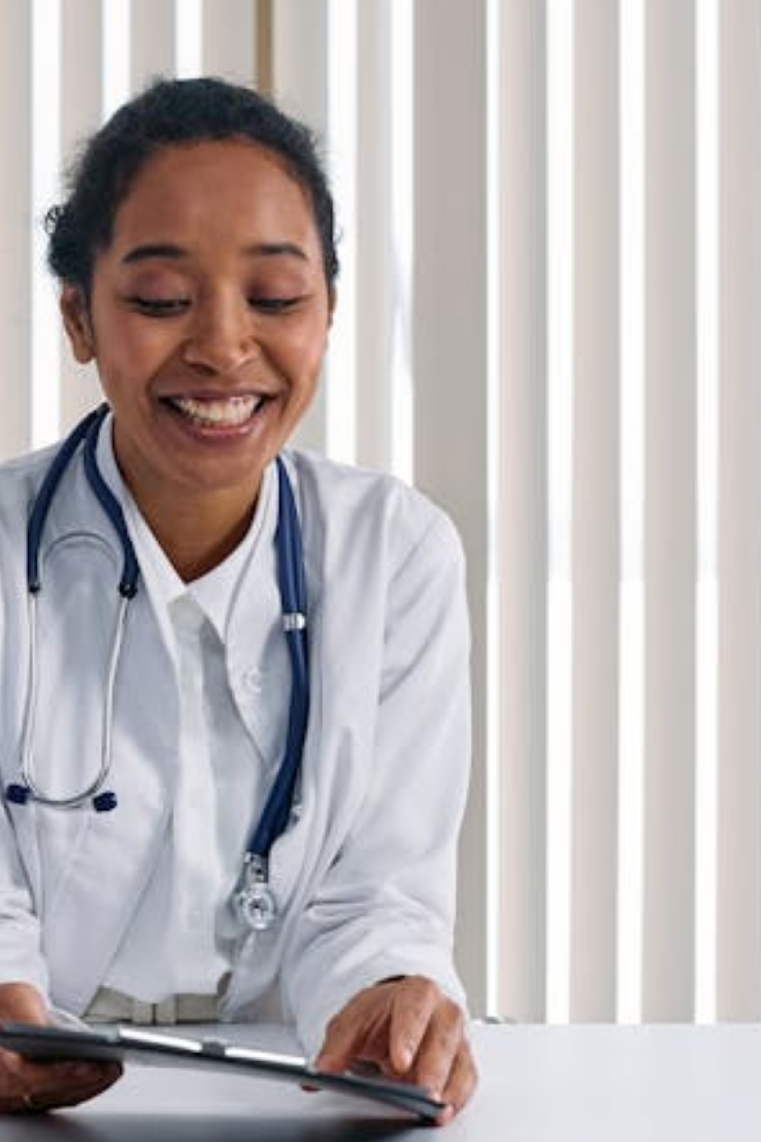 a bottle of medicine sitting on top of a bed