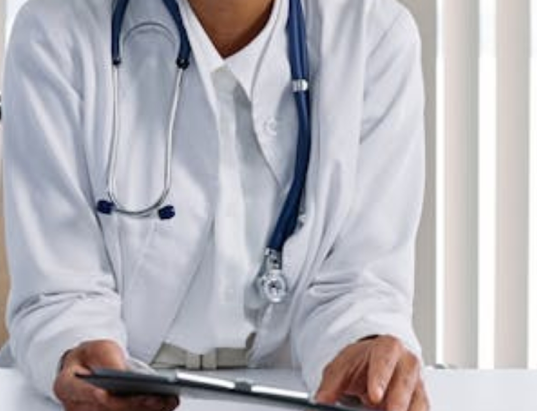 white bed comforter set and brown wooden bed frame beside brown wooden nightstand